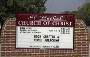 Sign in front of building